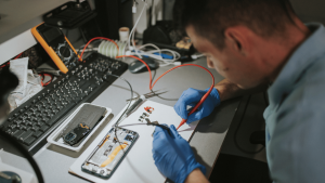 Student gaining practical skills through a mobile repairing course in Hyderabad.